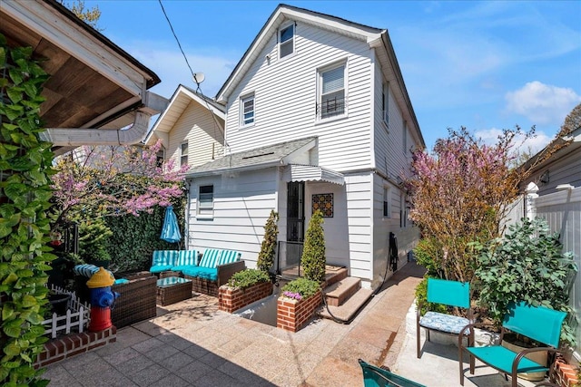 23 Bonta St, Elmont, NY 11003 - back of property with an outdoor living space and a patio area