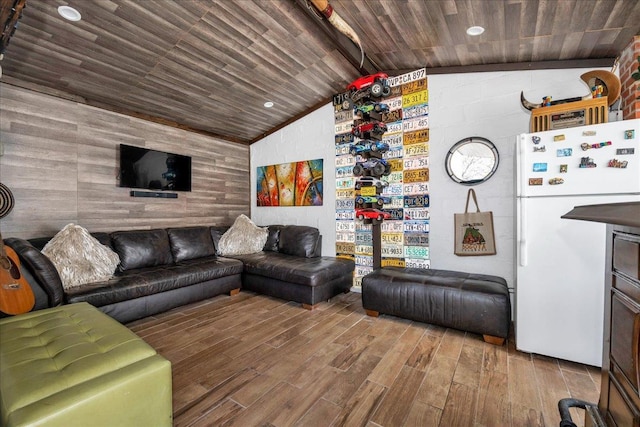23 Bonta St, Elmont, NY 11003 - living room featuring wood walls, wood finished floors, wooden ceiling, lofted ceiling, and an accent wall