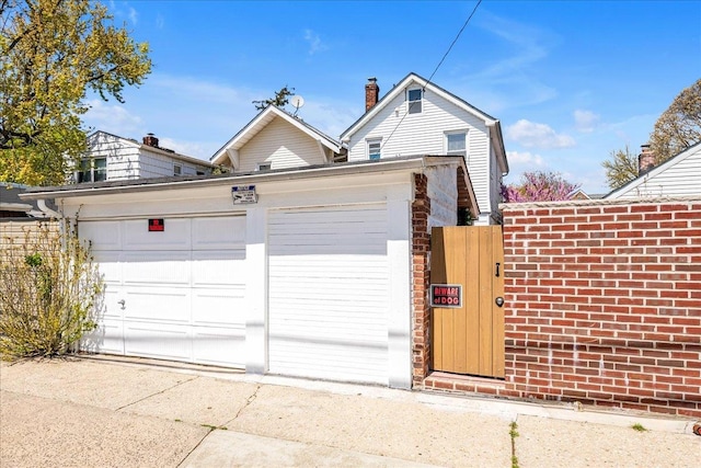 23 Bonta St, Elmont, NY 11003 - garage featuring a gate