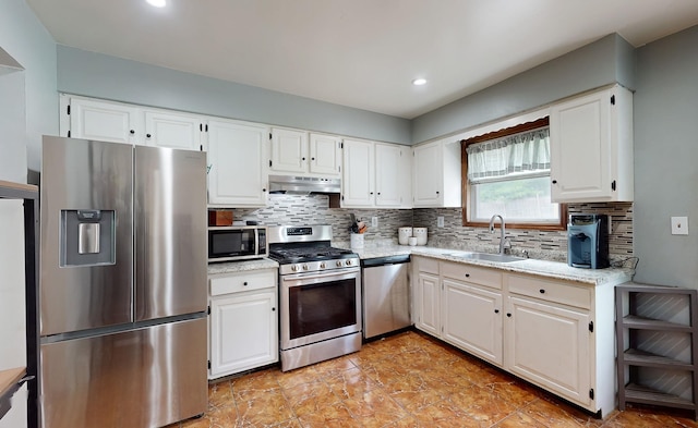 285 Riley Rd, New Windsor, NY 12553 - kitchen featuring appliances with stainless steel finishes, a sink, under cabinet range hood, tasteful backsplash, and recessed lighting