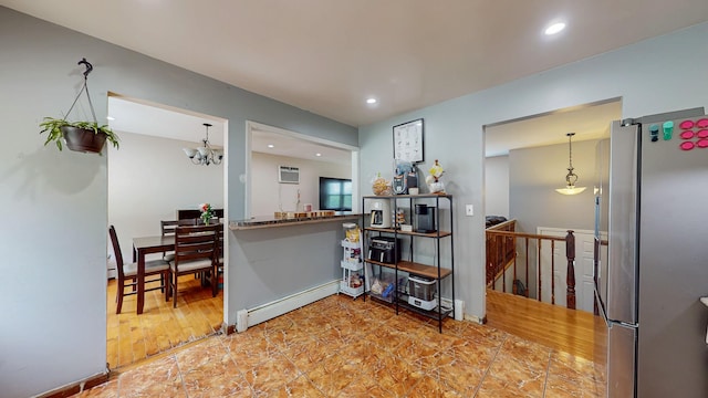 285 Riley Rd, New Windsor, NY 12553 - kitchen with freestanding refrigerator, a baseboard heating unit, recessed lighting, a chandelier, and an AC wall unit
