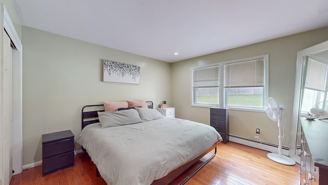 285 Riley Rd, New Windsor, NY 12553 - bedroom with light wood-type flooring, a baseboard radiator, baseboards, and recessed lighting