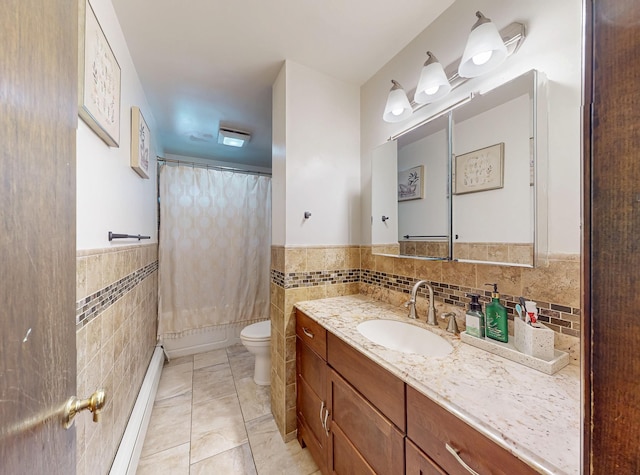 285 Riley Rd, New Windsor, NY 12553 - full bathroom with tile walls, vanity, toilet, baseboard heating, and a shower with curtain