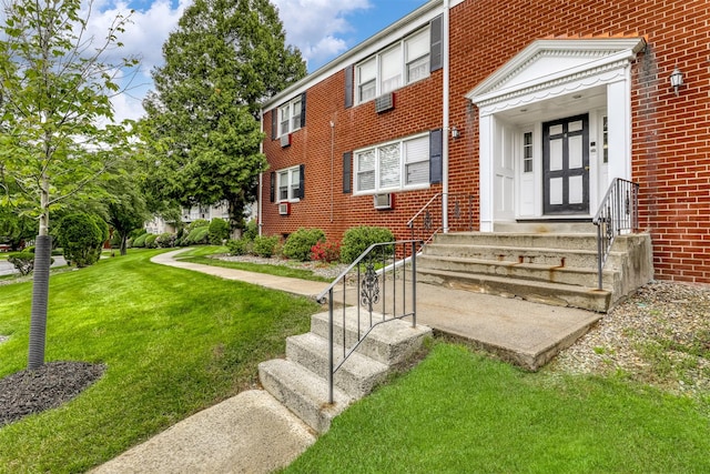 9 Danbury Ct Unit 1601, Suffern, NY 10901 - doorway to property with brick siding and a yard