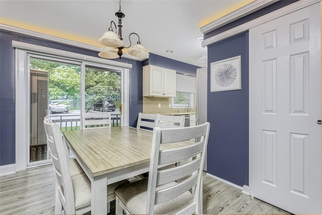 9 Danbury Ct Unit 1601, Suffern, NY 10901 - dining room with a chandelier, light wood finished floors, and baseboards