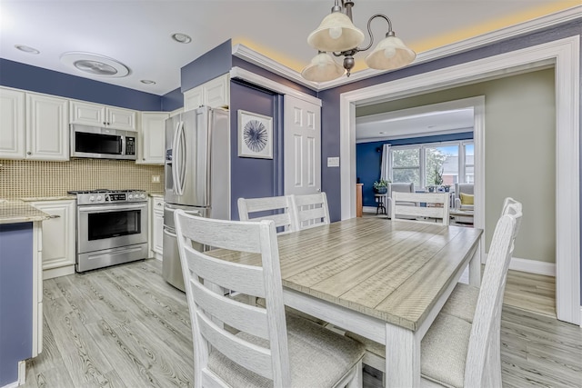 9 Danbury Ct Unit 1601, Suffern, NY 10901 - dining space featuring light wood-style floors and baseboards