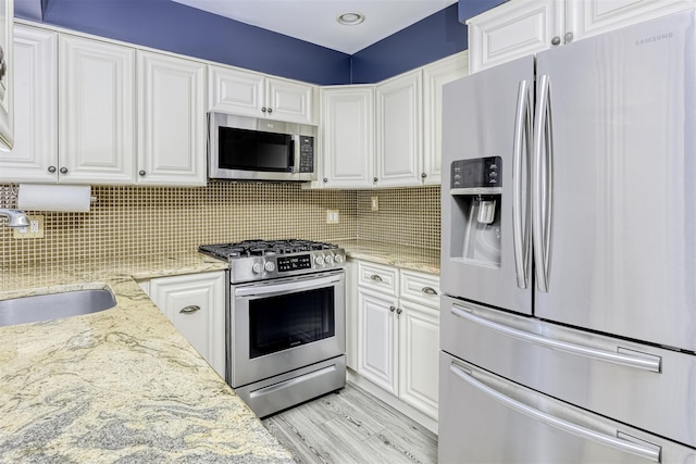 9 Danbury Ct Unit 1601, Suffern, NY 10901 - kitchen featuring stainless steel appliances, a sink, and white cabinetry