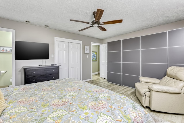 9 Danbury Ct Unit 1601, Suffern, NY 10901 - bedroom with wood finished floors, a textured ceiling, a closet, a ceiling fan, and baseboards