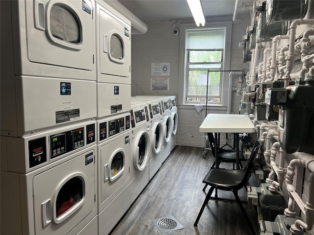 19 William St Unit 3G, Mount Vernon, NY 10552 - shared laundry featuring stacked washer / drying machine and wood finished floors