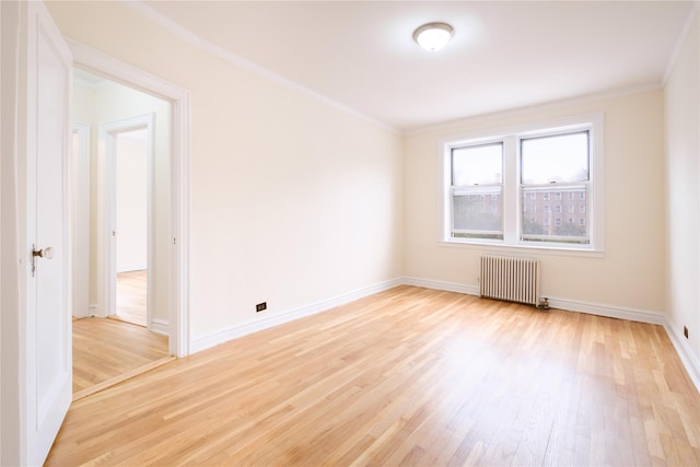 19 William St Unit 3G, Mount Vernon, NY 10552 - empty room with radiator, light wood-style flooring, and ornamental molding