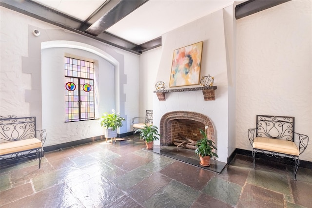 19 William St Unit 3G, Mount Vernon, NY 10552 - sitting room featuring stone tile floors, a fireplace, and beam ceiling
