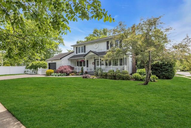 28 Bradford Rd, Plainview, NY 11803 - traditional-style house with covered porch, an attached garage, and concrete driveway