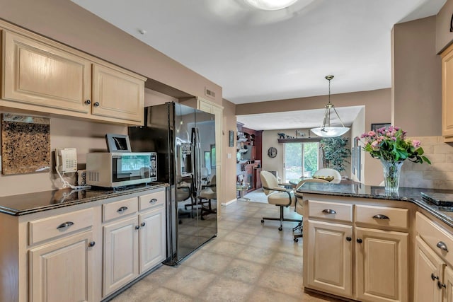28 Bradford Rd, Plainview, NY 11803 - kitchen with black fridge with ice dispenser, stainless steel microwave, backsplash, an office area, and light flooring