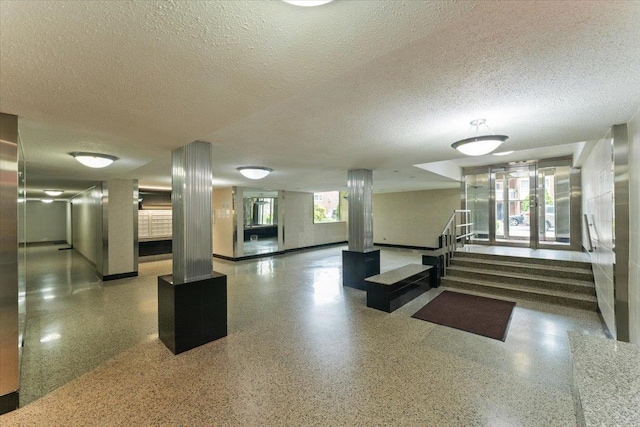 31-90 140th St Unit 3K, Flushing, NY 11354 - building lobby featuring stairs and a textured ceiling