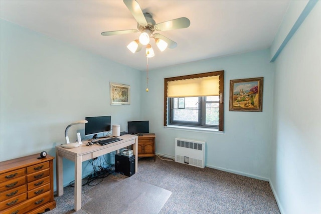 31-90 140th St Unit 3K, Flushing, NY 11354 - office area with radiator heating unit, dark carpet, a ceiling fan, and baseboards