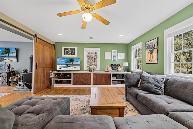 21 Mile Rd, Suffern, NY 10901 - living room featuring healthy amount of natural light, wood finished floors, a barn door, and recessed lighting