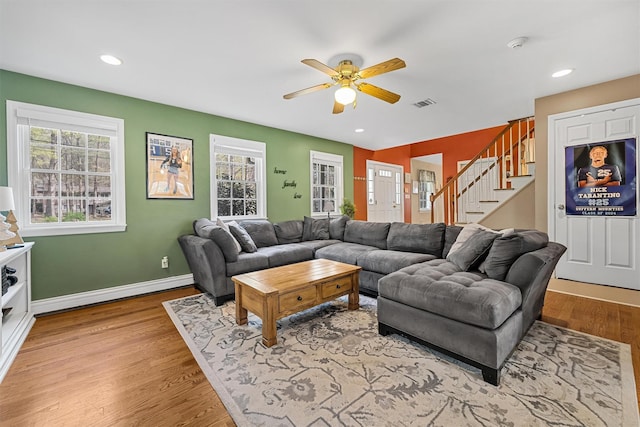 21 Mile Rd, Suffern, NY 10901 - living area featuring a ceiling fan, wood finished floors, stairs, baseboards, and a baseboard heating unit