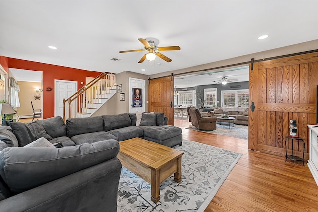 21 Mile Rd, Suffern, NY 10901 - living room with a barn door, ceiling fan, stairway, light wood-style floors, and recessed lighting