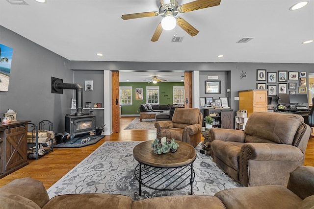 21 Mile Rd, Suffern, NY 10901 - living room with a ceiling fan, light wood-style flooring, recessed lighting, a wood stove, and decorative columns