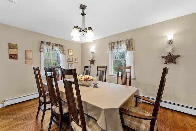 21 Mile Rd, Suffern, NY 10901 - dining area with a chandelier, a baseboard radiator, and wood finished floors