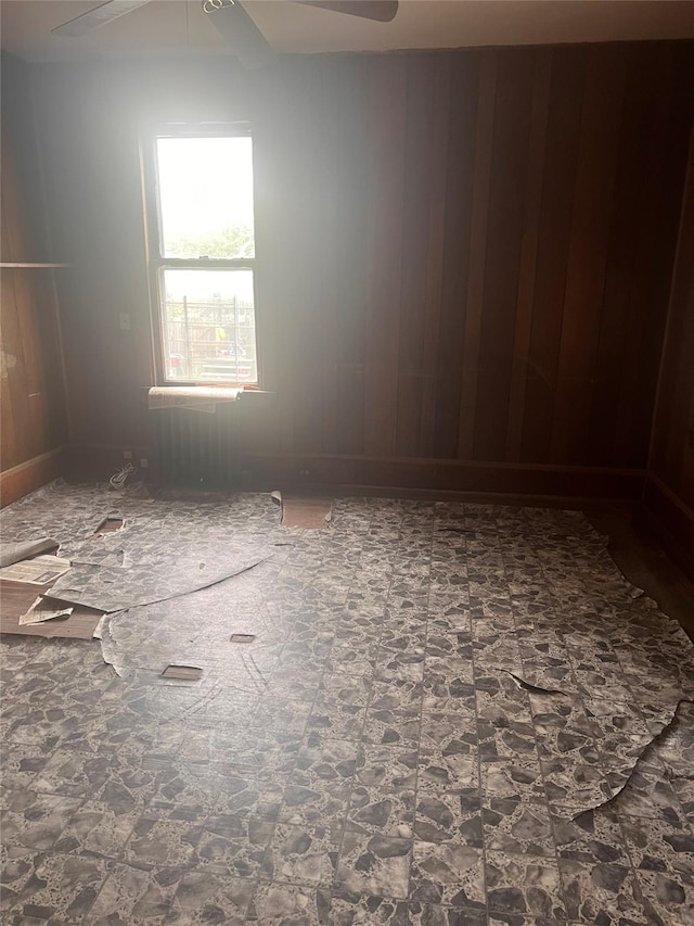 95 W Van Ness St, Newburgh, NY 12550 - unfurnished room featuring a ceiling fan and wood walls