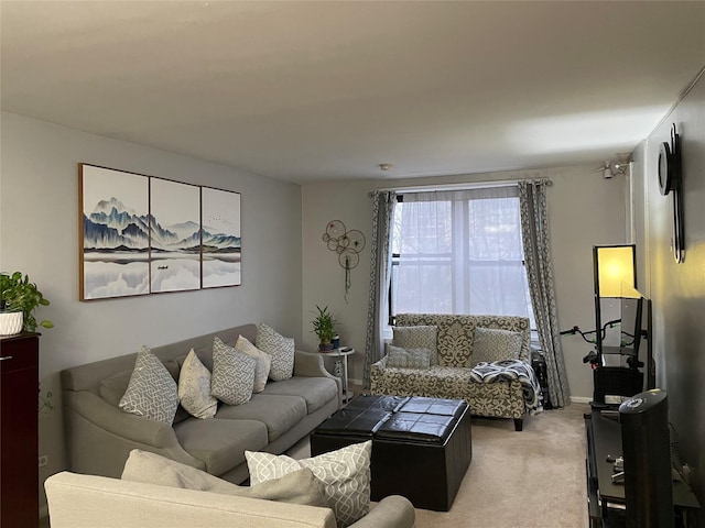 87-70 173rd St Unit 5E, Jamaica, NY 11432 - living room featuring light colored carpet and baseboards