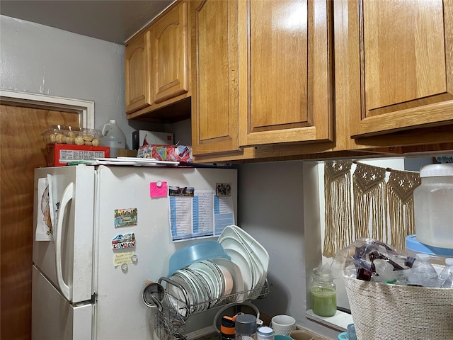 87-70 173rd St Unit 5E, Jamaica, NY 11432 - kitchen view of freestanding refrigerator and brown cabinets