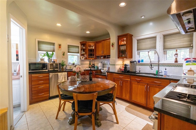 42-32 204th St, Bayside, NY 11361 - kitchen with stainless steel appliances, a sink, brown cabinets, recessed lighting, and dark countertops