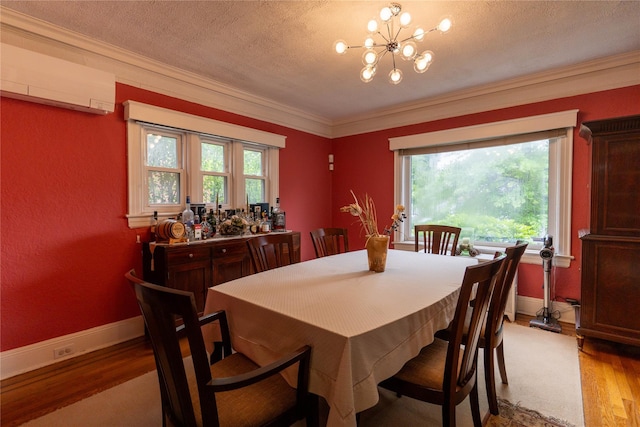 42-32 204th St, Bayside, NY 11361 - dining space with a wall mounted AC, wood finished floors, ornamental molding, a chandelier, and a textured ceiling