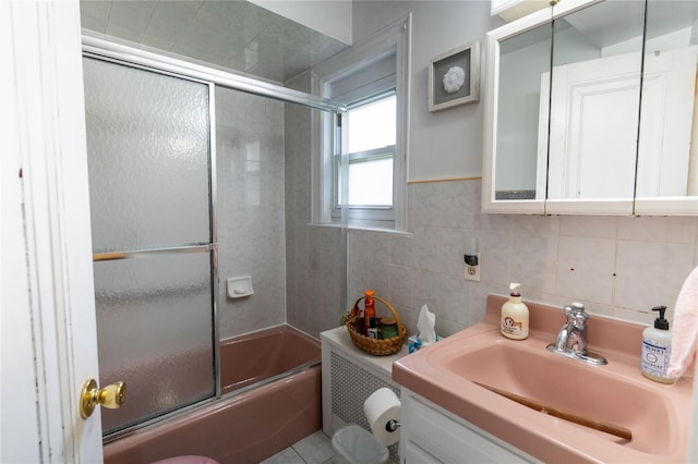 42-32 204th St, Bayside, NY 11361 - bathroom featuring vanity, enclosed tub / shower combo, toilet, and tile walls