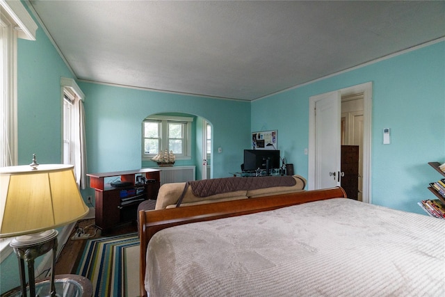 42-32 204th St, Bayside, NY 11361 - bedroom with arched walkways, wood finished floors, and ornamental molding