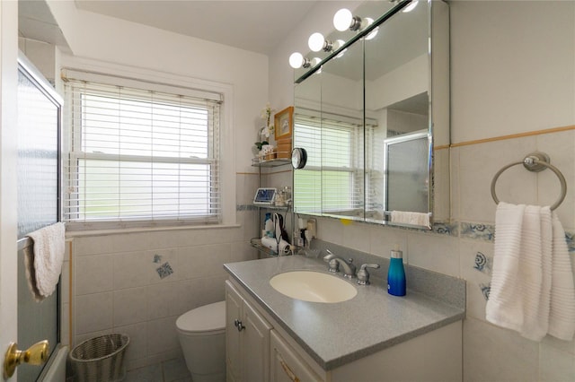42-32 204th St, Bayside, NY 11361 - full bathroom with tile walls, an enclosed shower, vanity, toilet, and tasteful backsplash