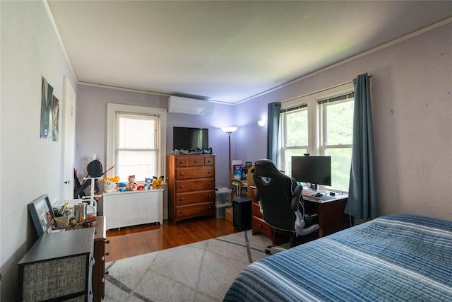 42-32 204th St, Bayside, NY 11361 - bedroom featuring wood finished floors, multiple windows, a desk, ornamental molding, and an AC wall unit