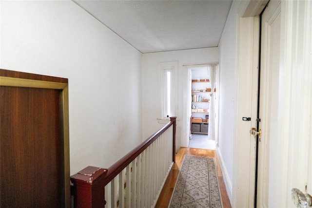 42-32 204th St, Bayside, NY 11361 - hall with light wood-type flooring and an upstairs landing