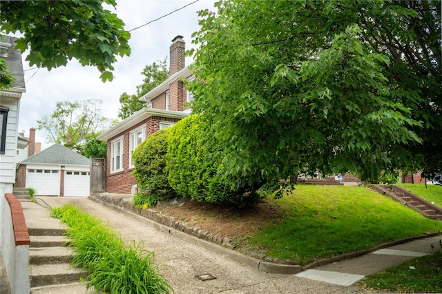 42-32 204th St, Bayside, NY 11361 - view of side of home featuring brick siding, a garage, an outbuilding, a chimney, and a yard