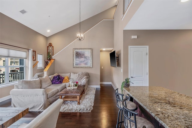 135 Rosebud Ct Unit 135, Patchogue, NY 11772 - living room featuring dark wood-type flooring, high vaulted ceiling, baseboards, and stairs