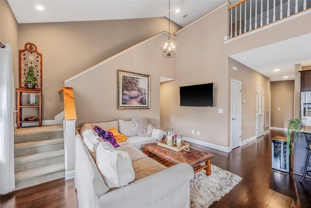 135 Rosebud Ct Unit 135, Patchogue, NY 11772 - living area with wood finished floors, high vaulted ceiling, baseboards, a chandelier, and stairway