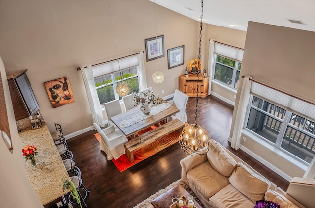 135 Rosebud Ct Unit 135, Patchogue, NY 11772 - living area featuring high vaulted ceiling, plenty of natural light, and dark wood-style floors