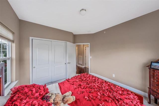 135 Rosebud Ct Unit 135, Patchogue, NY 11772 - carpeted bedroom featuring baseboards and a closet