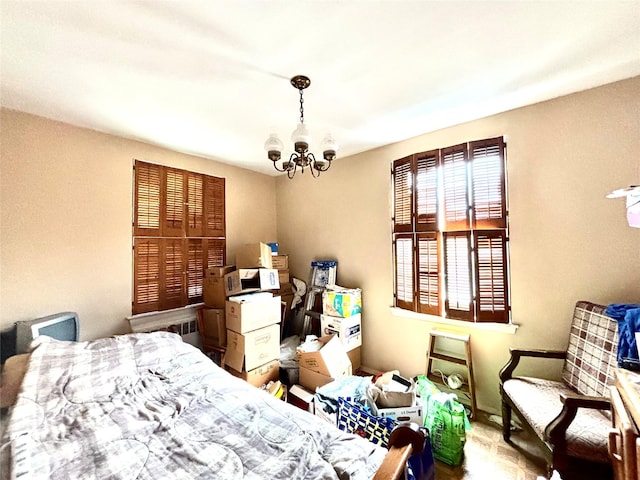 26-20 141st St Unit 1E, Flushing, NY 11354 - bedroom featuring a chandelier