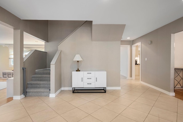 82 Woods Dr, East Hills, NY 11576 - staircase featuring tile patterned floors, baseboards, and recessed lighting