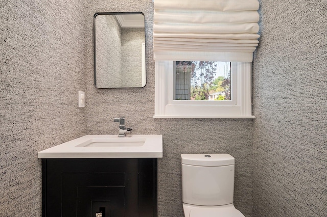 82 Woods Dr, East Hills, NY 11576 - half bathroom featuring vanity, toilet, and tile walls