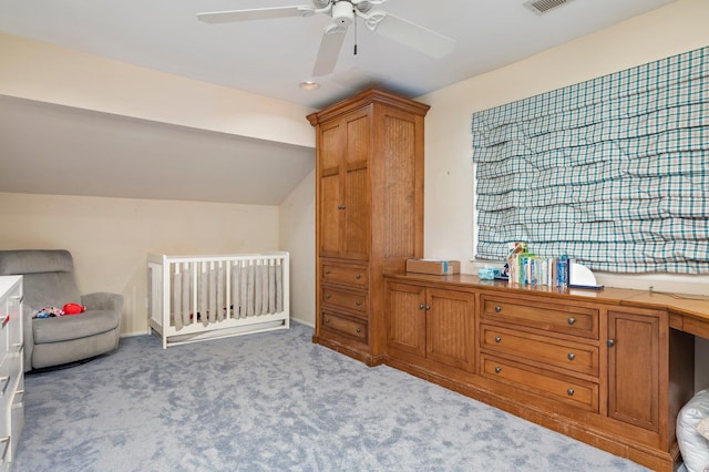 82 Woods Dr, East Hills, NY 11576 - carpeted bedroom with lofted ceiling, ceiling fan, and a crib
