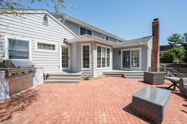 82 Woods Dr, East Hills, NY 11576 - rear view of house with a patio and a wooden deck