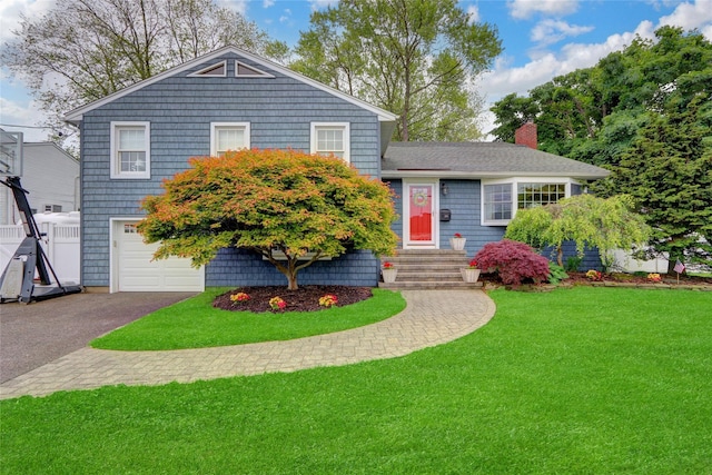 100 Fairfax Rd, Massapequa, NY 11758 - view of front facade featuring an attached garage, a chimney, a front lawn, and asphalt driveway