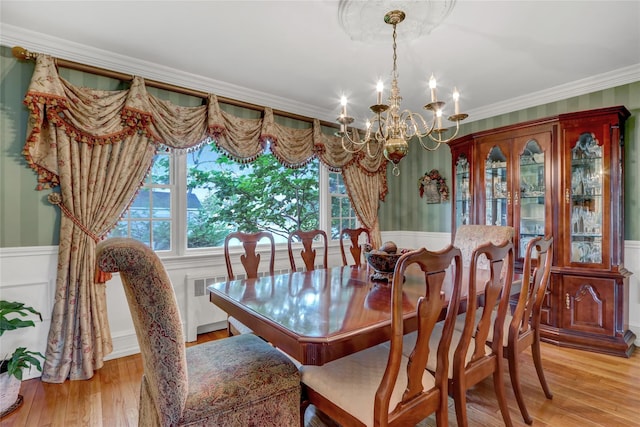 100 Fairfax Rd, Massapequa, NY 11758 - dining room with a chandelier, light wood finished floors, crown molding, and a wainscoted wall