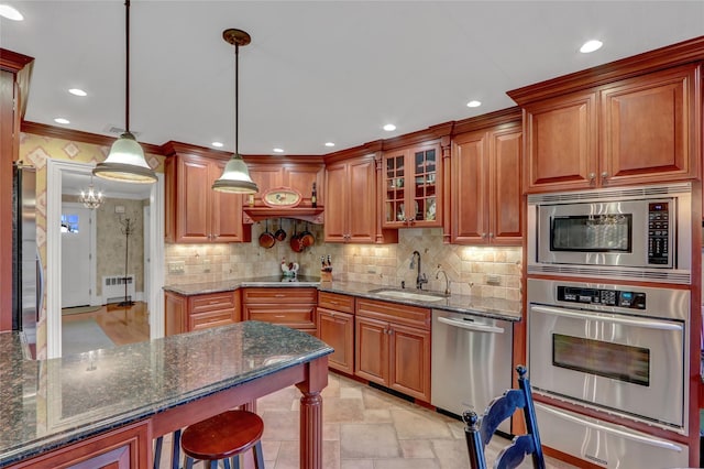 100 Fairfax Rd, Massapequa, NY 11758 - kitchen with appliances with stainless steel finishes, radiator, a sink, a warming drawer, and stone tile flooring