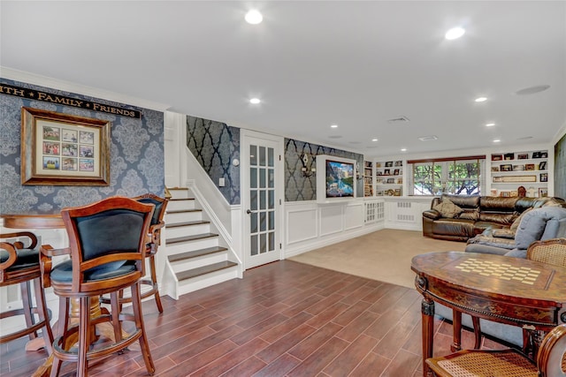 100 Fairfax Rd, Massapequa, NY 11758 - living area with wallpapered walls, recessed lighting, a wainscoted wall, stairway, and dark wood-style floors