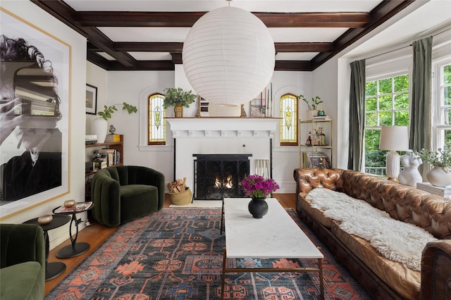 305 Park Hill Ave, Yonkers, NY 10705 - living area featuring wood finished floors, plenty of natural light, coffered ceiling, a lit fireplace, and beamed ceiling