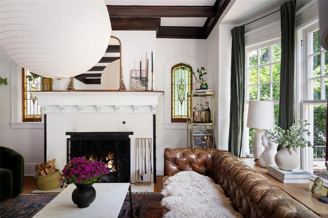 305 Park Hill Ave, Yonkers, NY 10705 - living room featuring a warm lit fireplace and wood finished floors